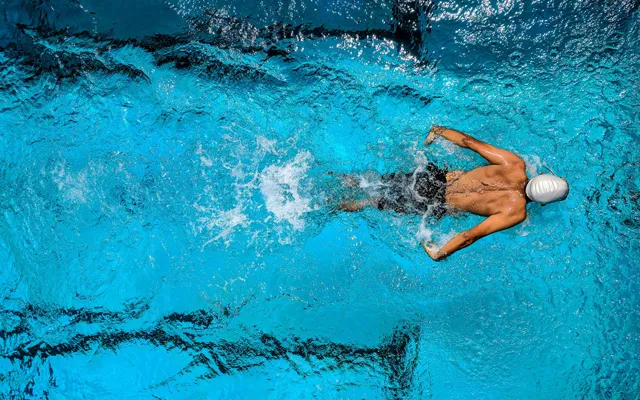 Man swimming in pool